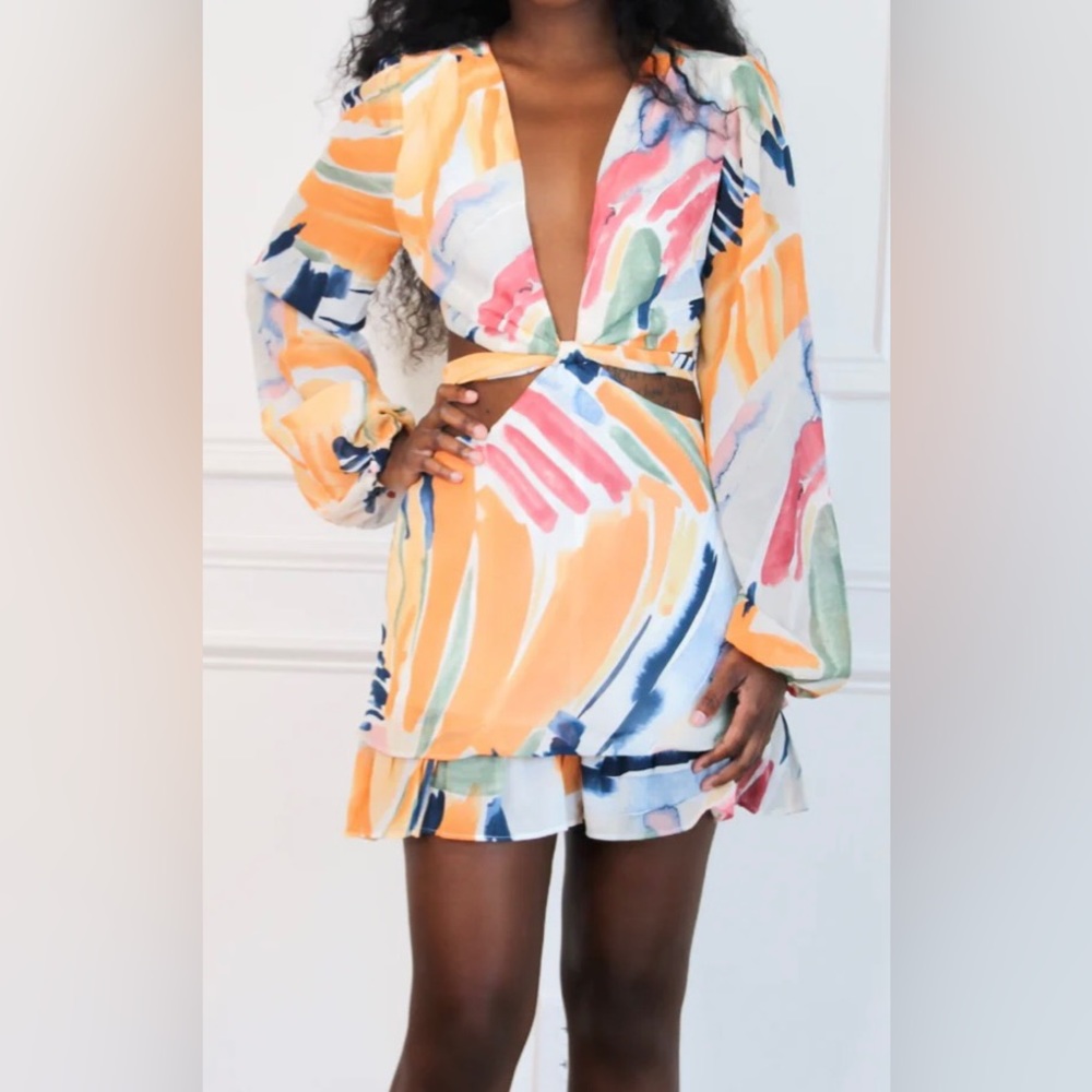NWOT Long-Sleeved Cut-Out Romper (dress) by The Vintage Shop. Size Medium